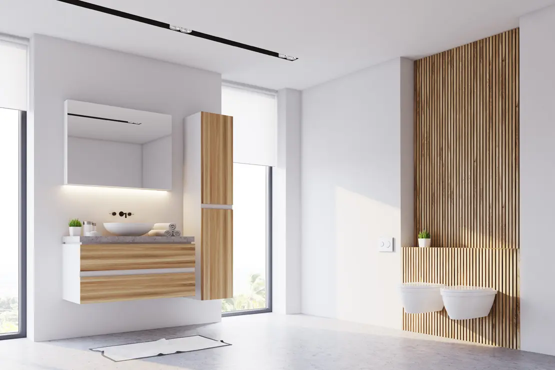 Salle de bain avec sol en béton ciré gris et éléments en bois Salle de bain avec sol en béton ciré gris et éléments en bois